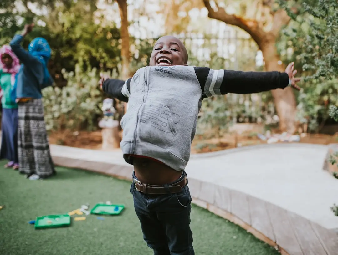 happy-child-with-arms-outstretched-in-a-garden
